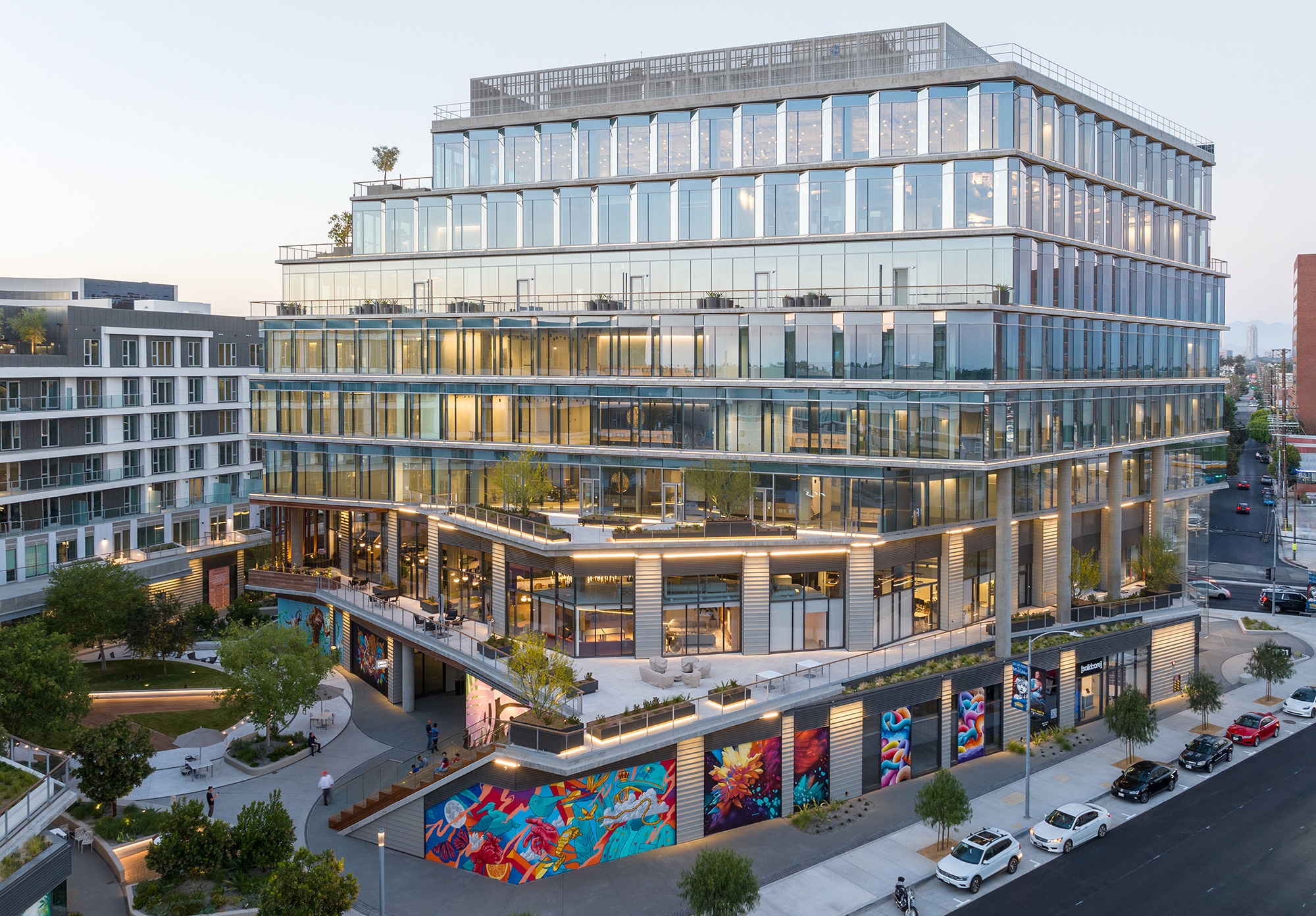 A large building with a parking lot.