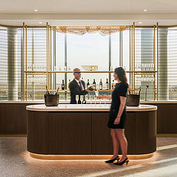 A person standing at a bar.