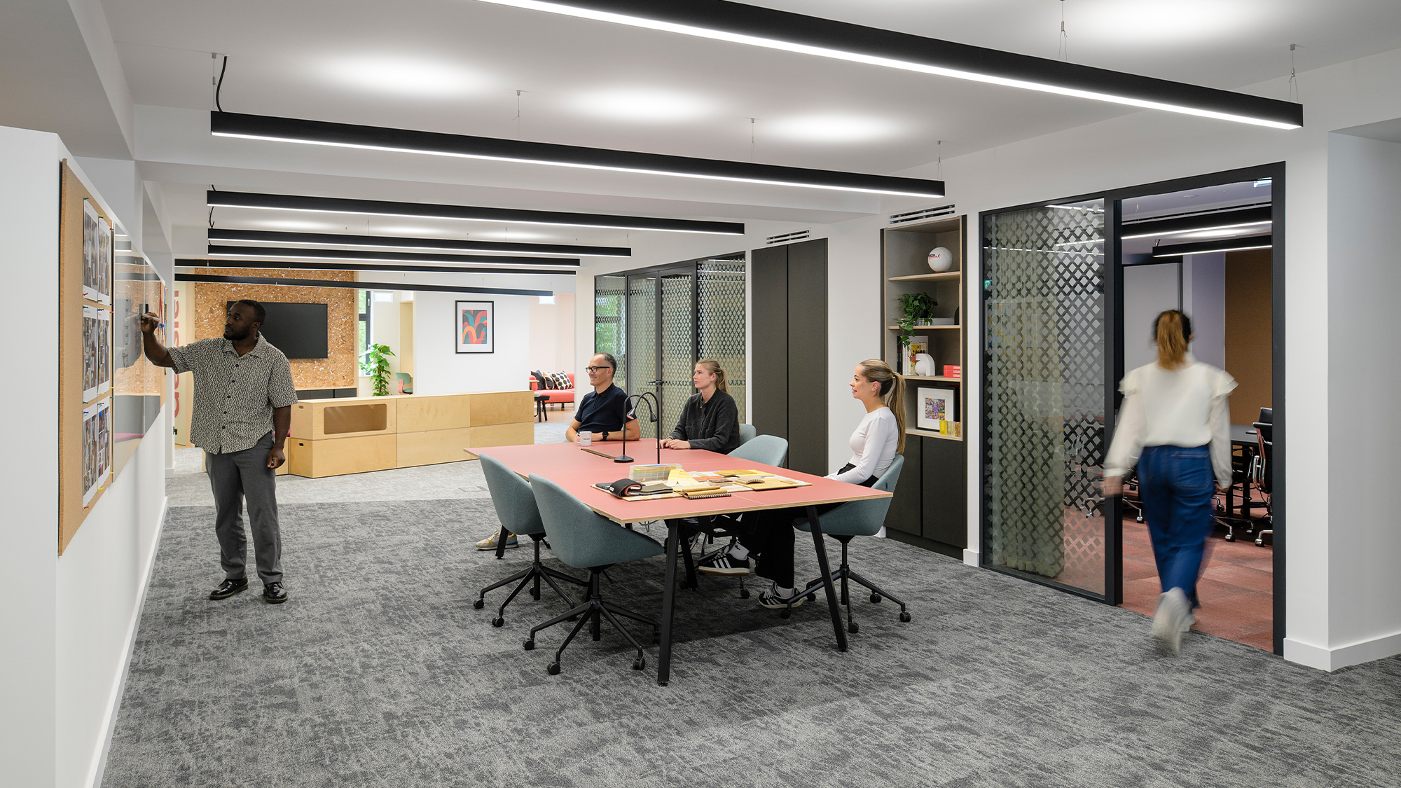 A group of people sitting around a table.