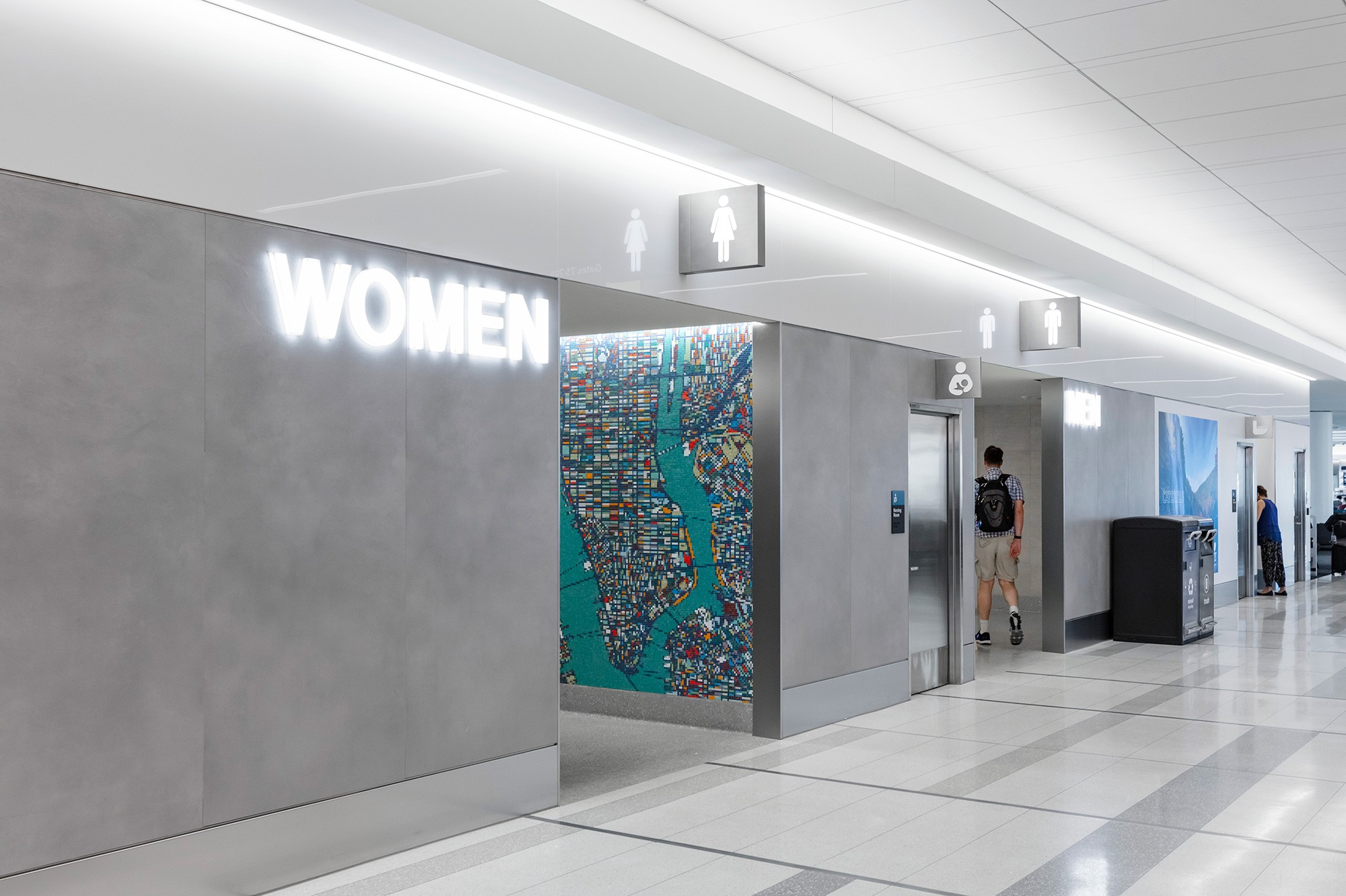 A person walking in a hallway.