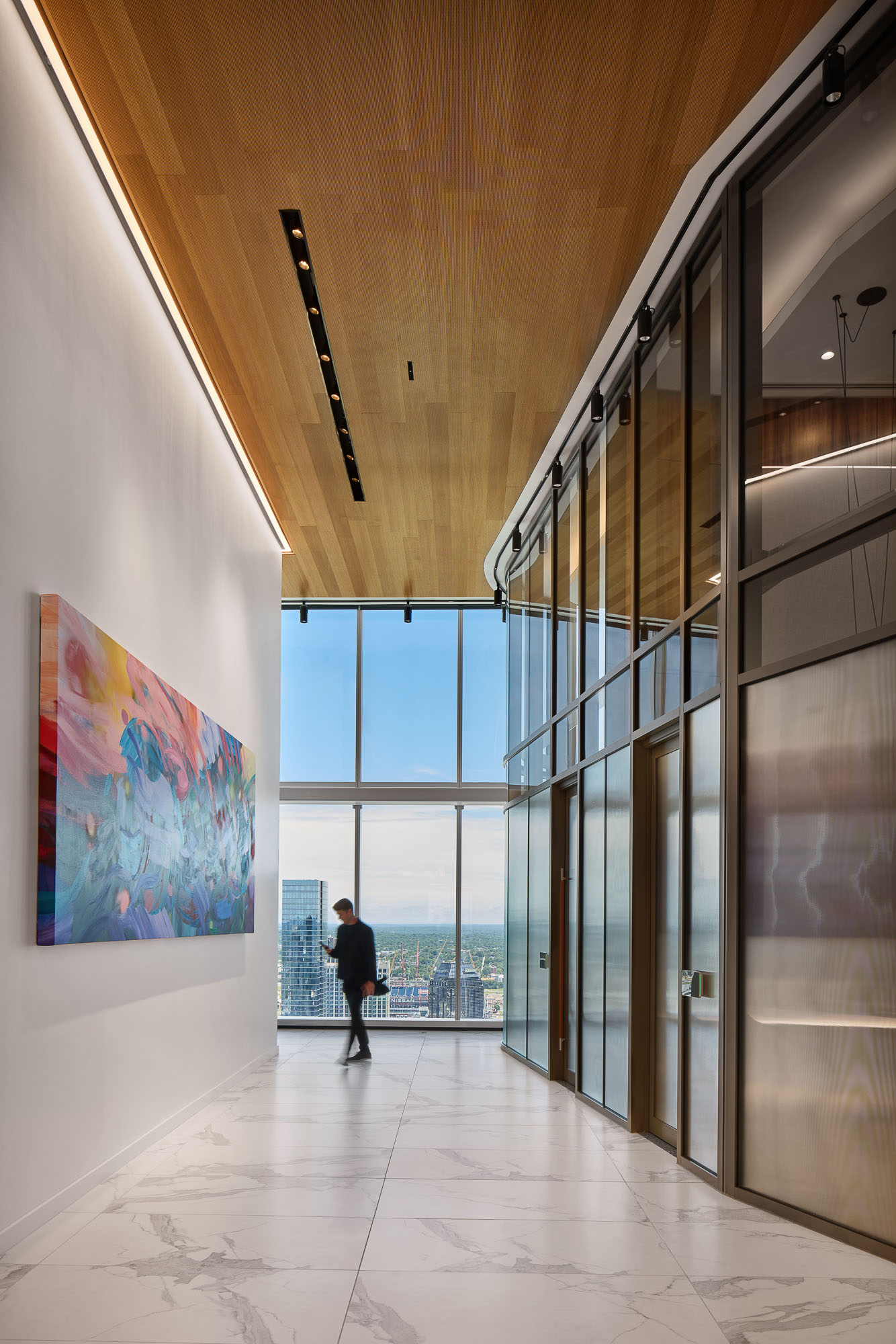 A person walking in a hallway.