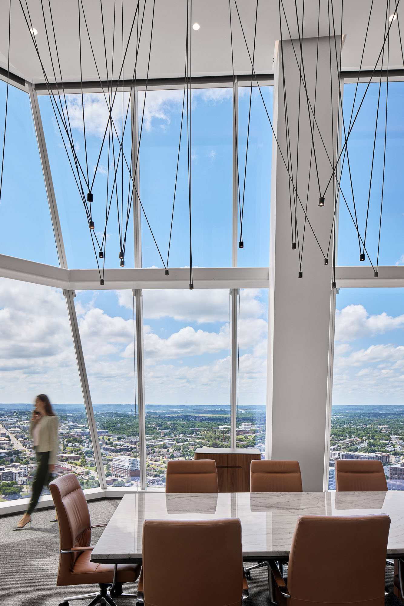 A person walking on a balcony.
