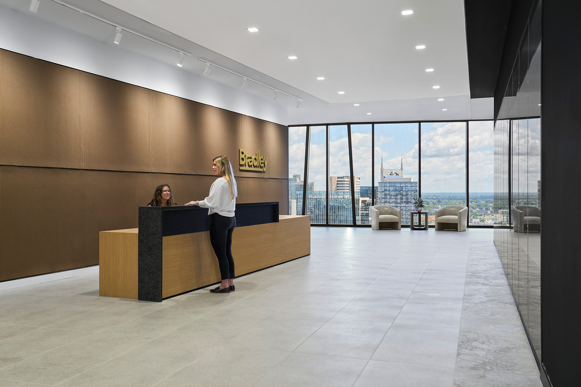 A person standing at a desk.
