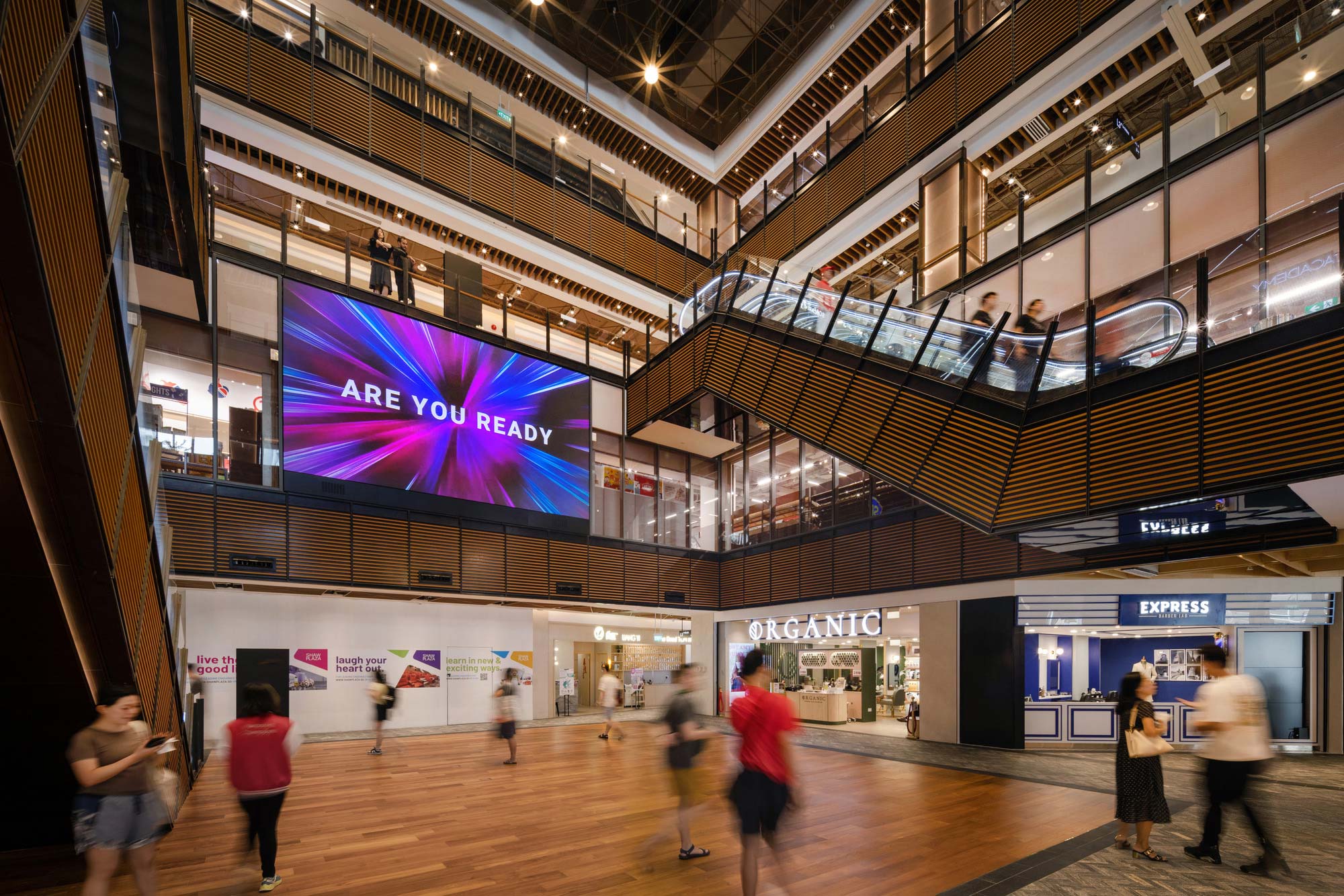A group of people walking inside a building.