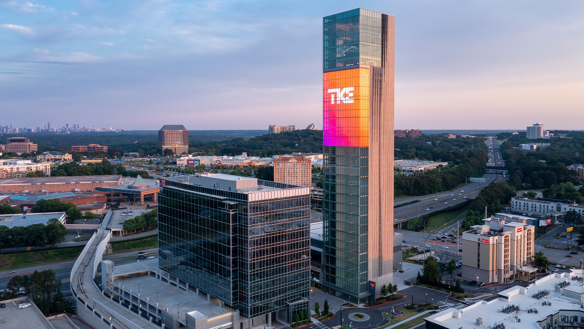 A tall building with a glass front.