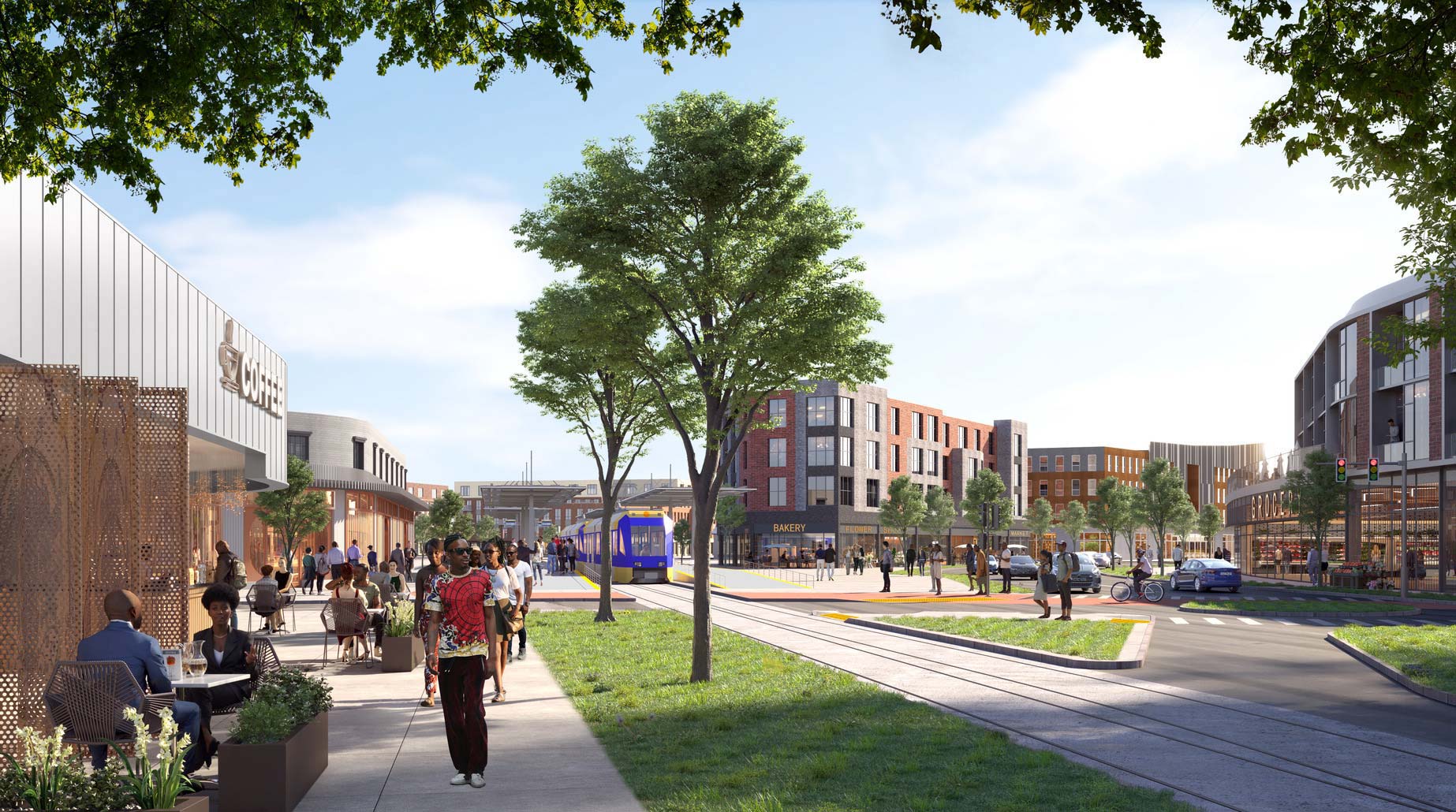 A group of people sitting on a sidewalk next to a building.