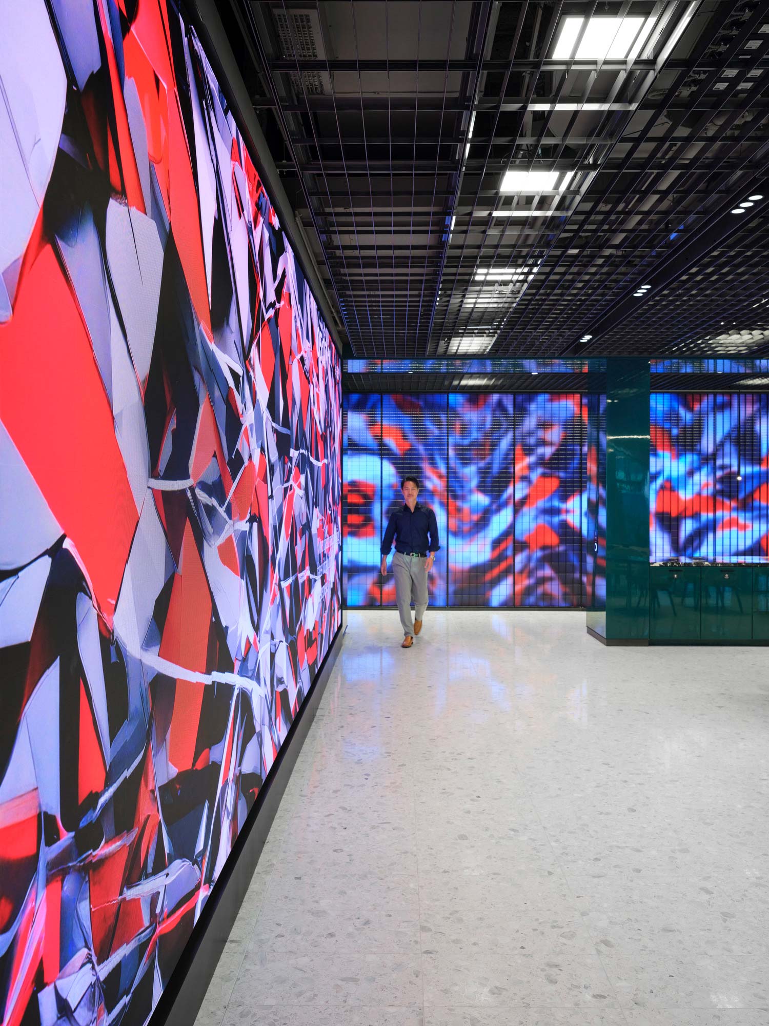 A man walking in a hallway.