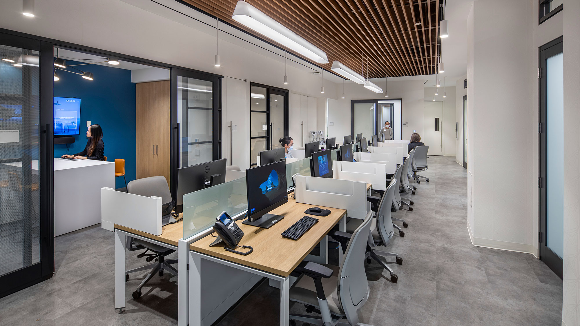 A room with computers and people.