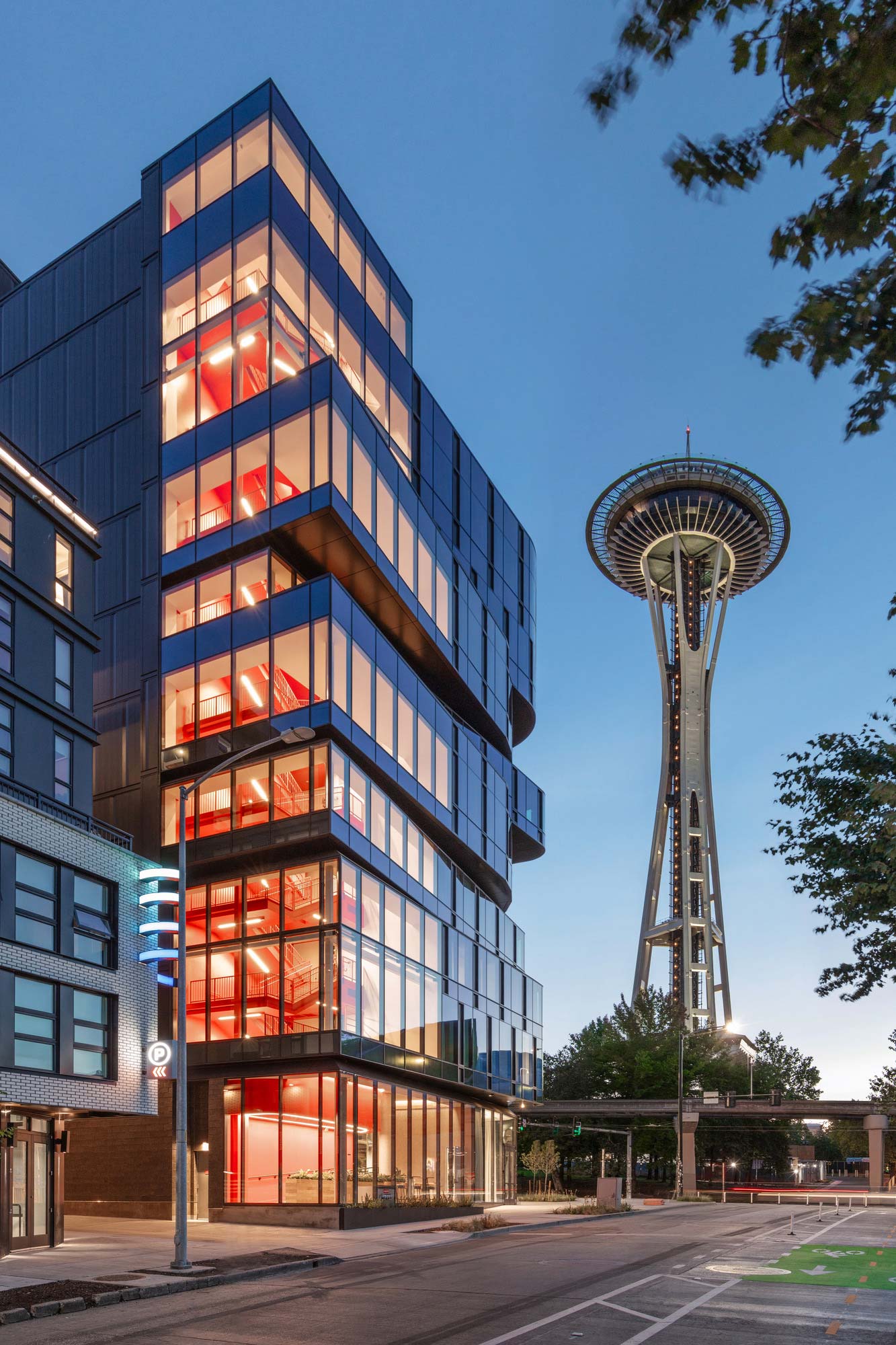 A building with a tower in the background.