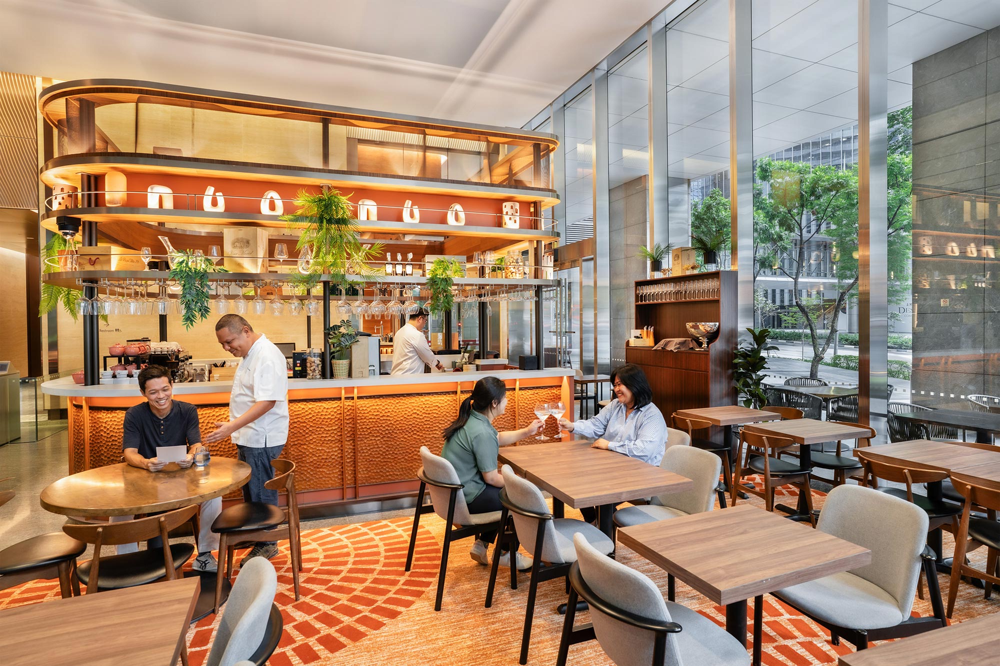 People sitting at tables in a restaurant.