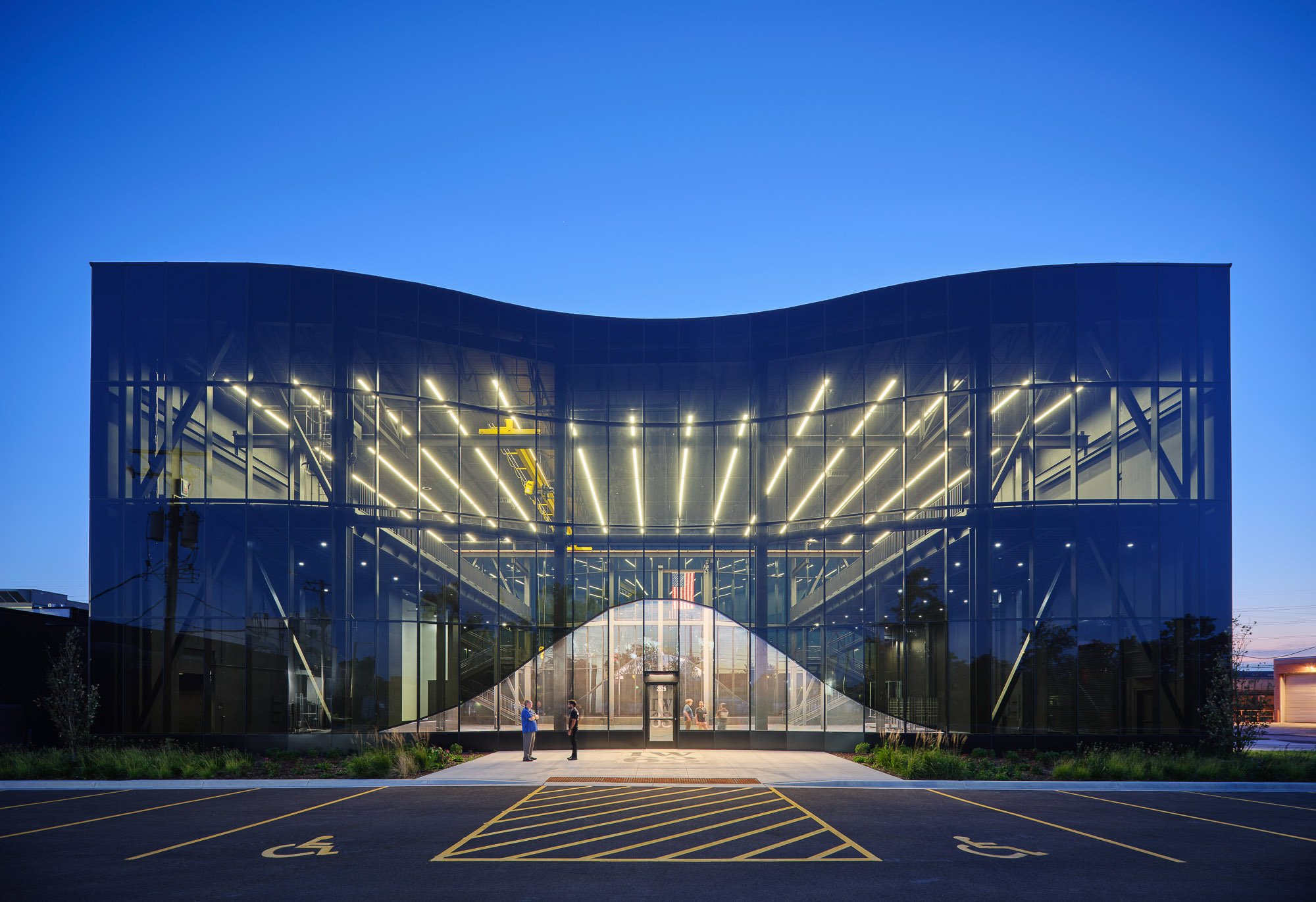 A large glass building with a large glass front.