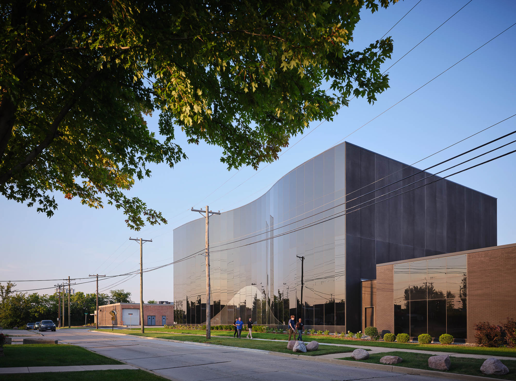 A large building with a road in front of it.