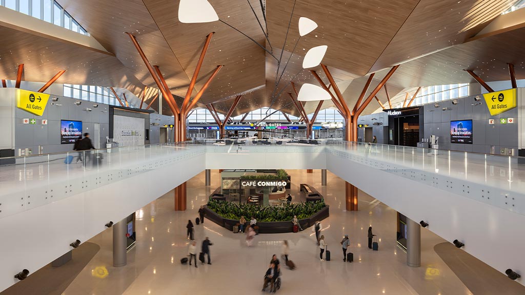 A large room with people and a large group of people.