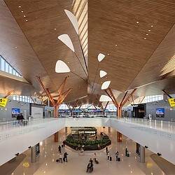 A large room with people and a large ceiling.
