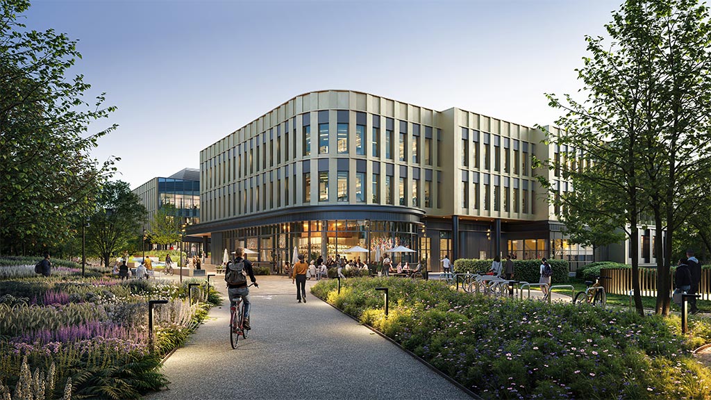 A person riding a bicycle on a path in front of a building.