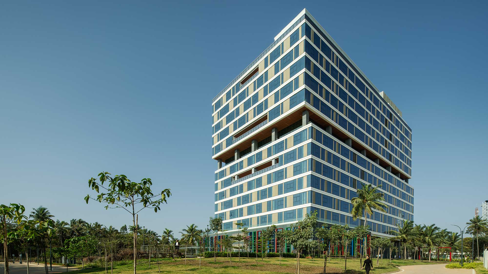 A tall building with trees in front of it.