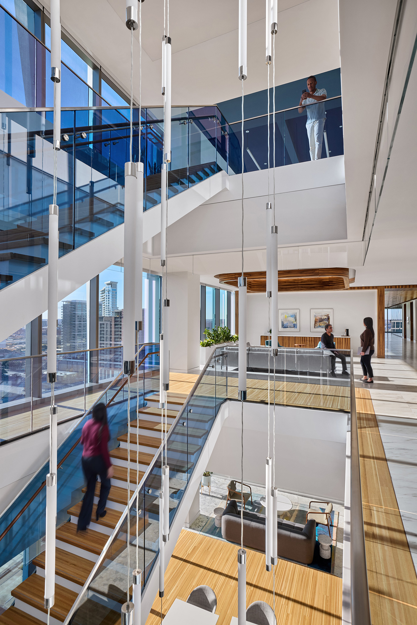 People walking up a staircase.