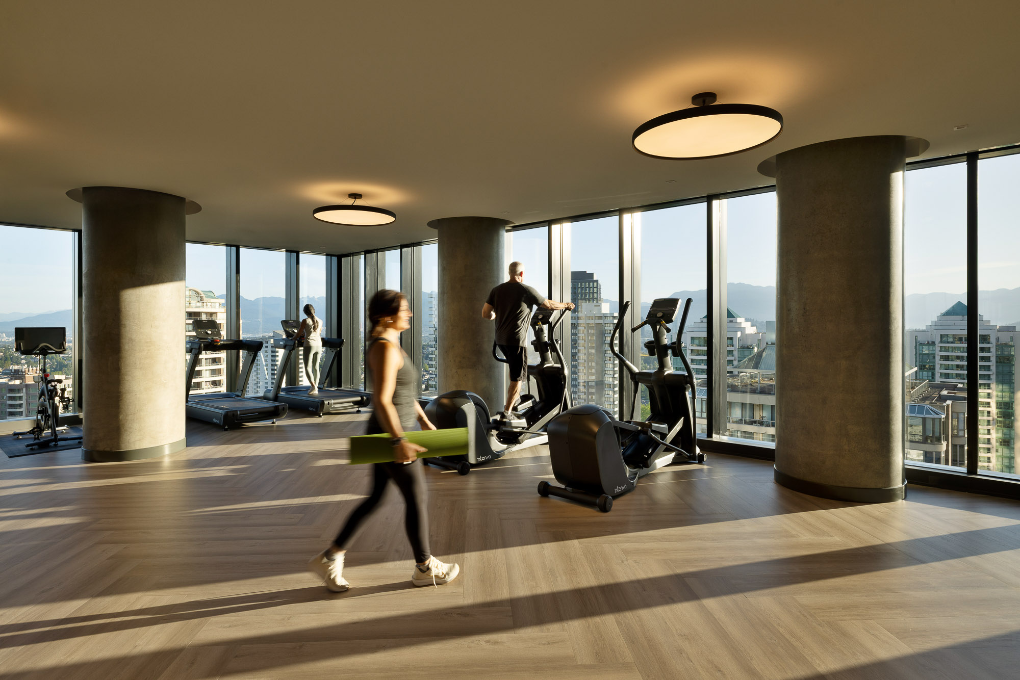 A person carrying a surfboard.