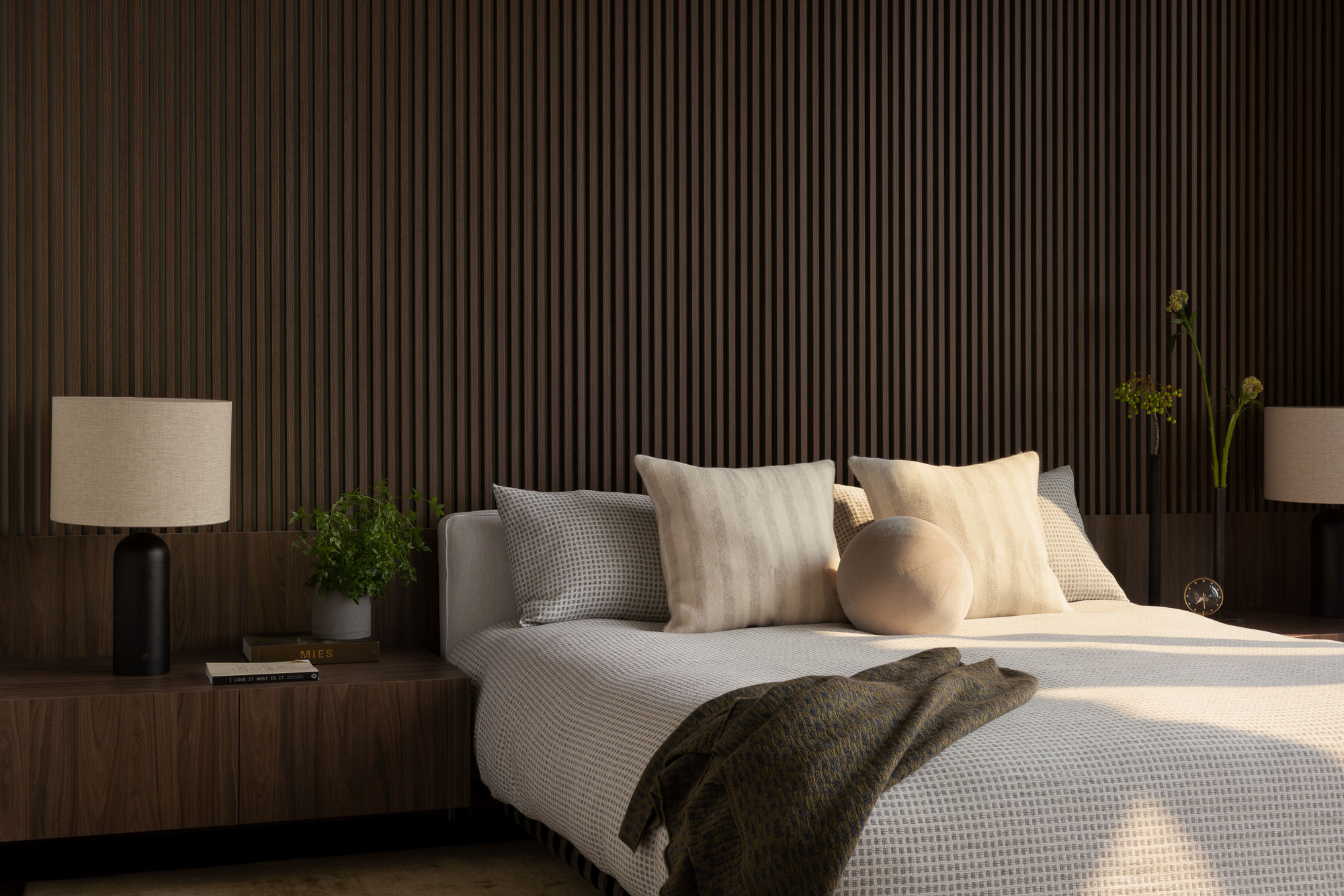 A bed with a blanket on it.