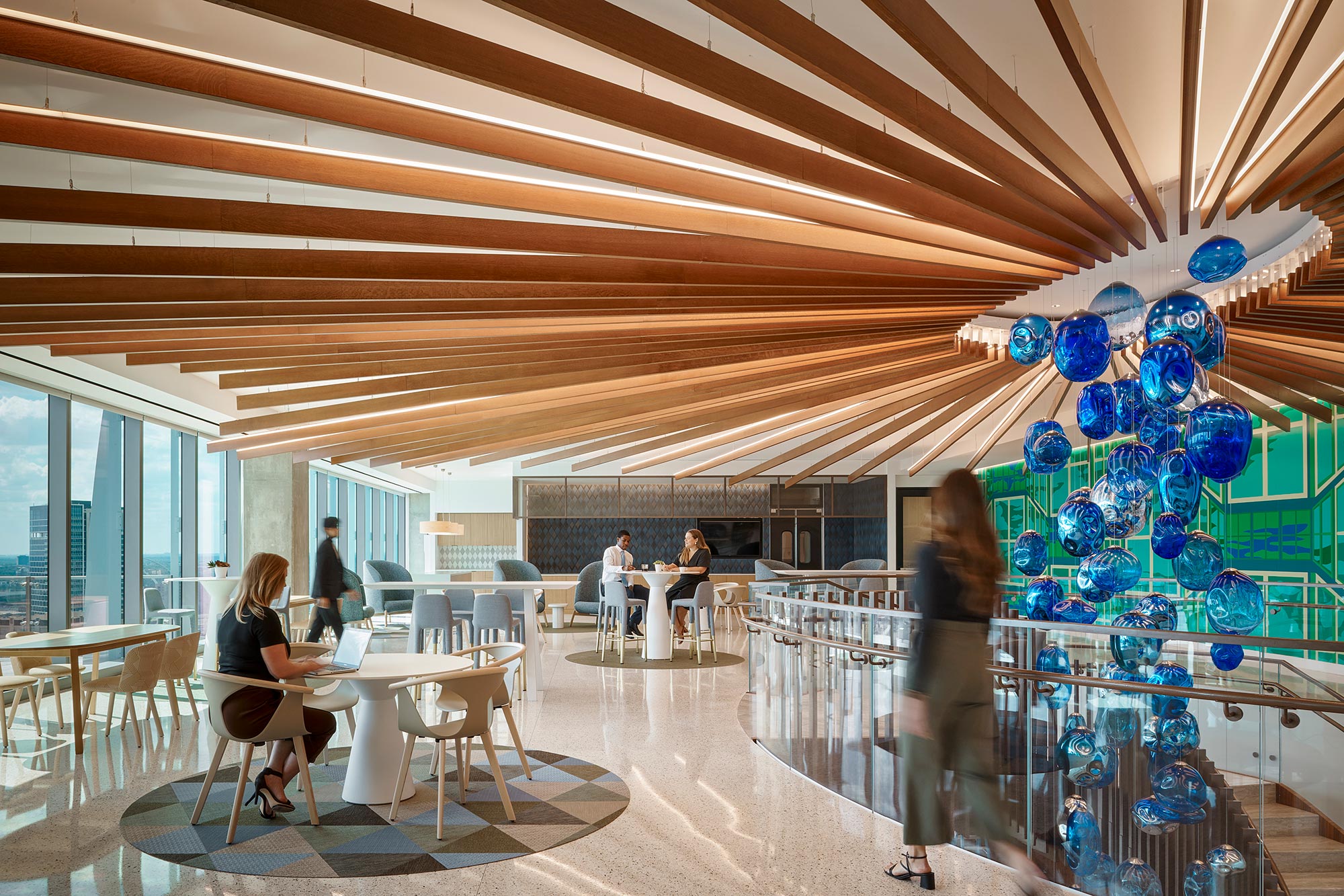 A group of people in a room with balloons.