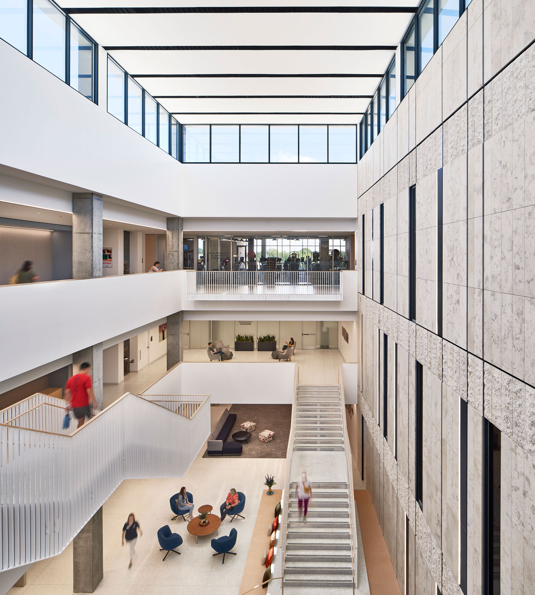 A group of people walking up stairs.