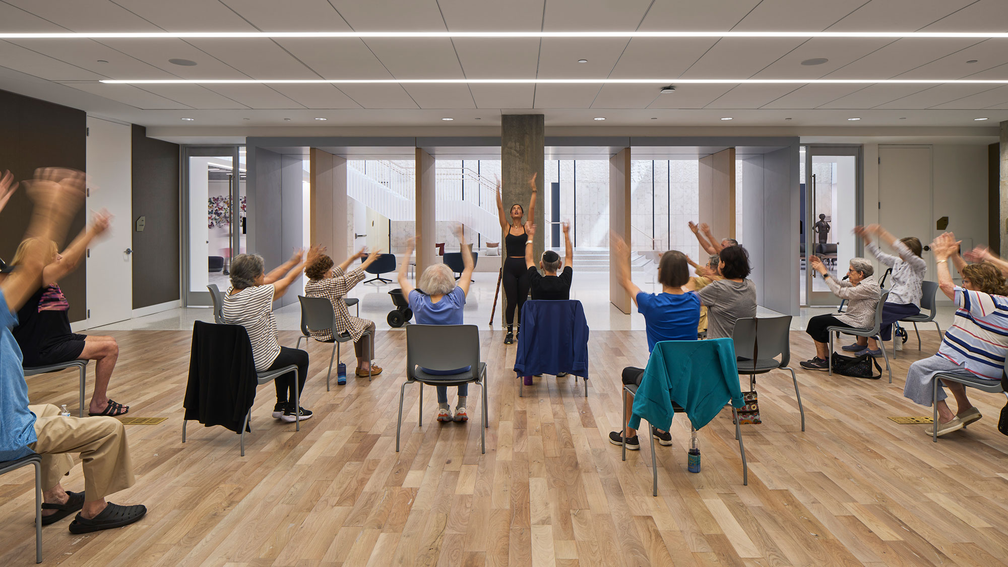 A group of people sitting in chairs.