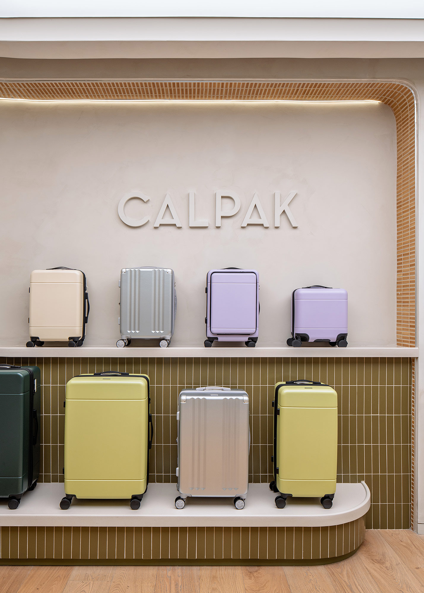 A shelf with several suitcases.