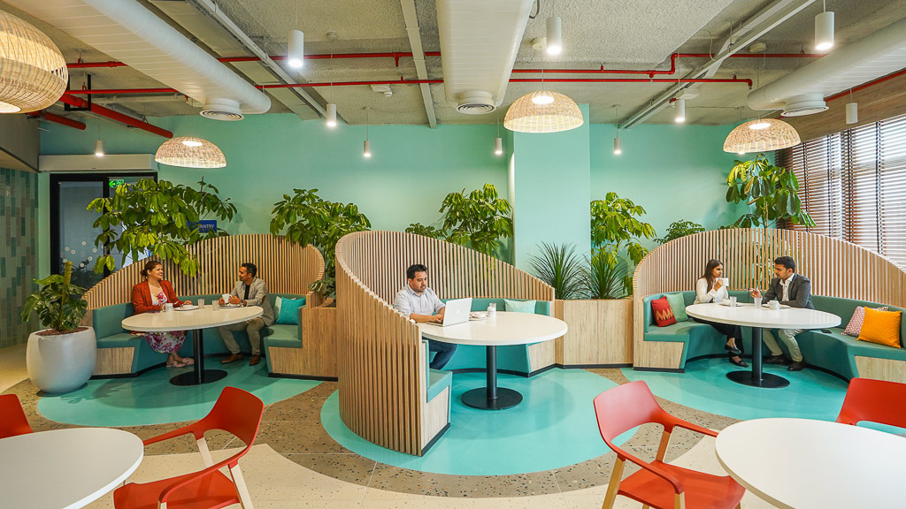 A group of people sitting at tables.