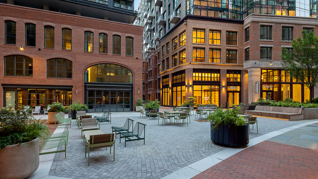 A courtyard with tables and chairs.
