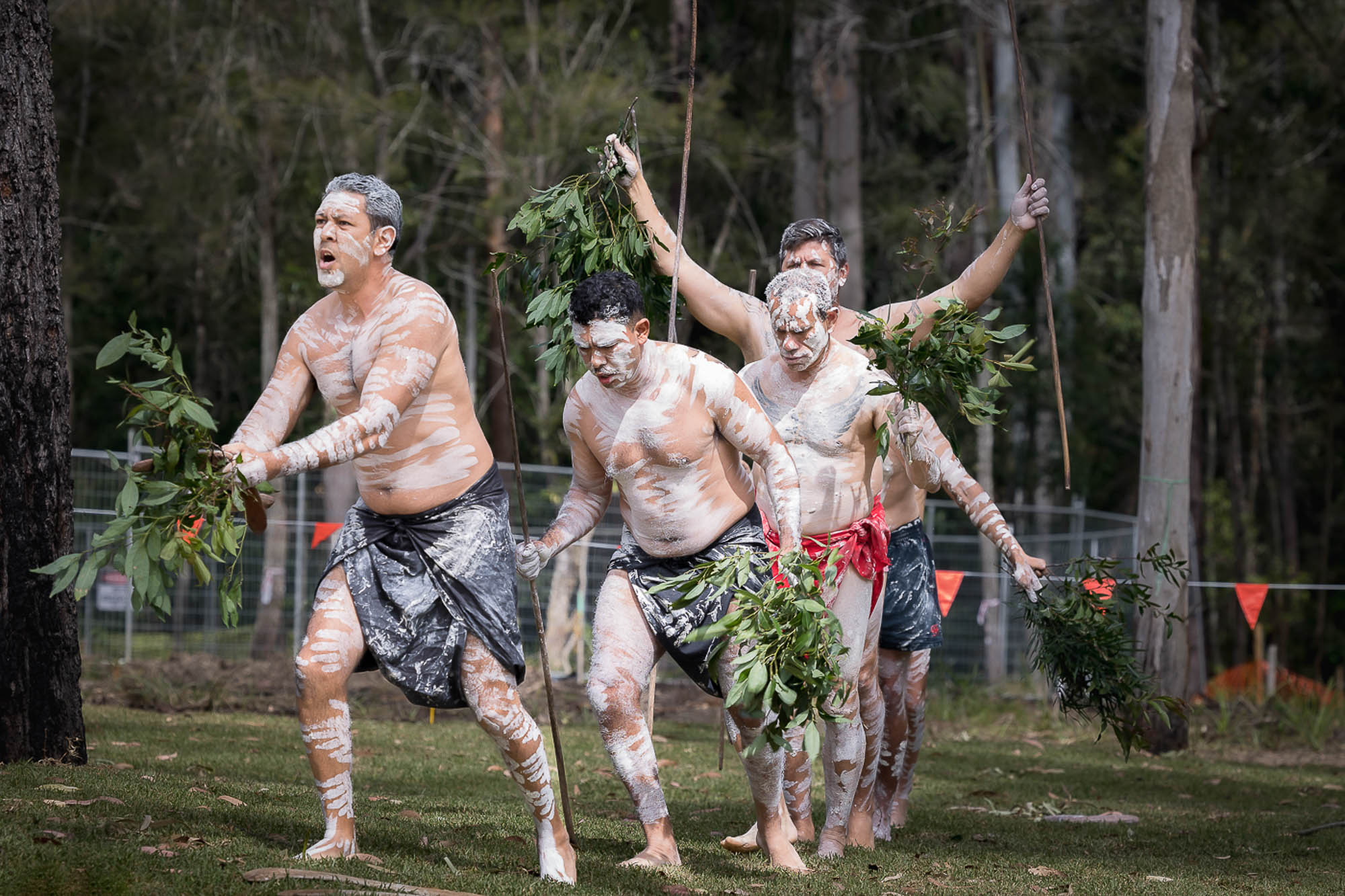 A group of men in a forest.