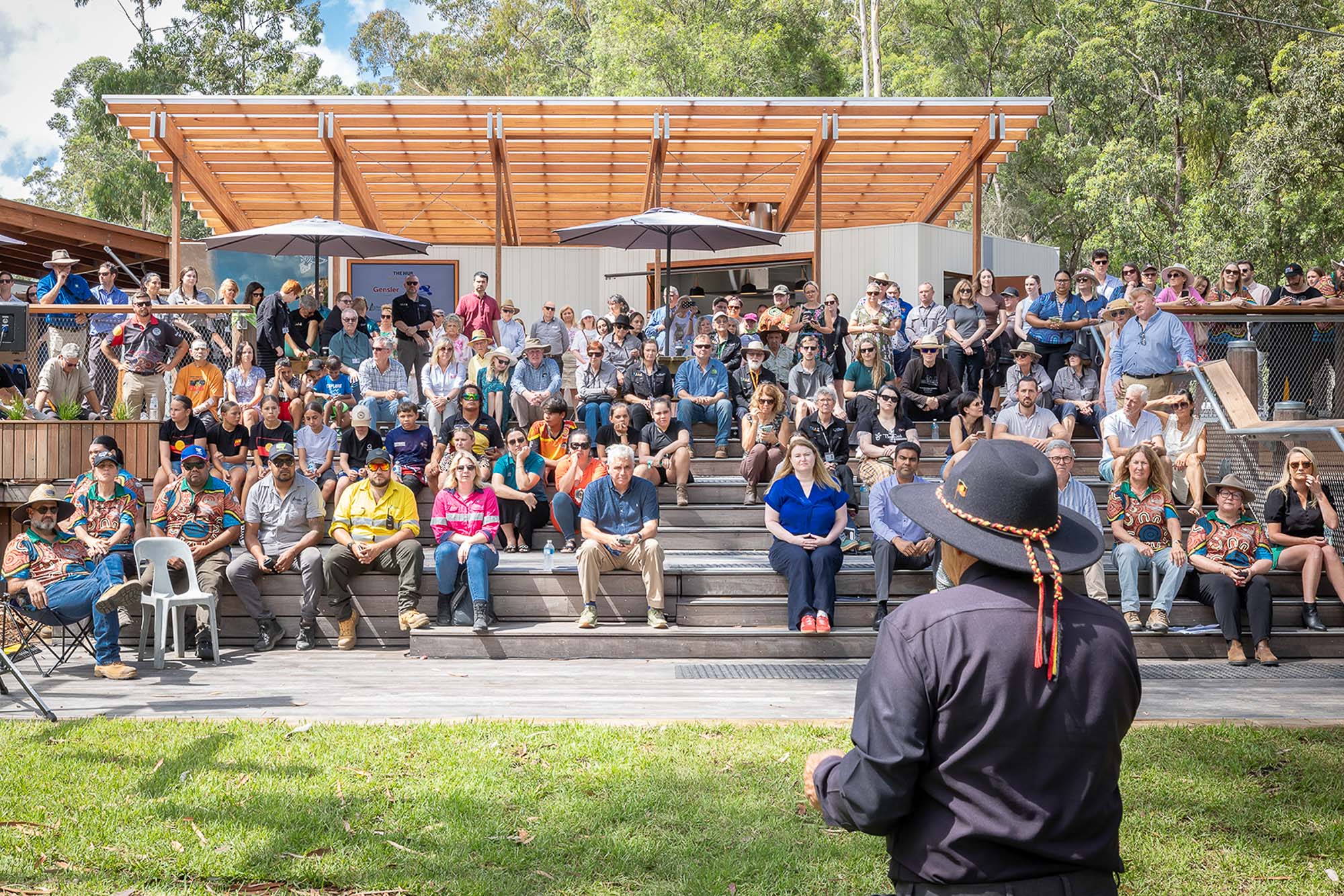 A person standing in front of a crowd of people.