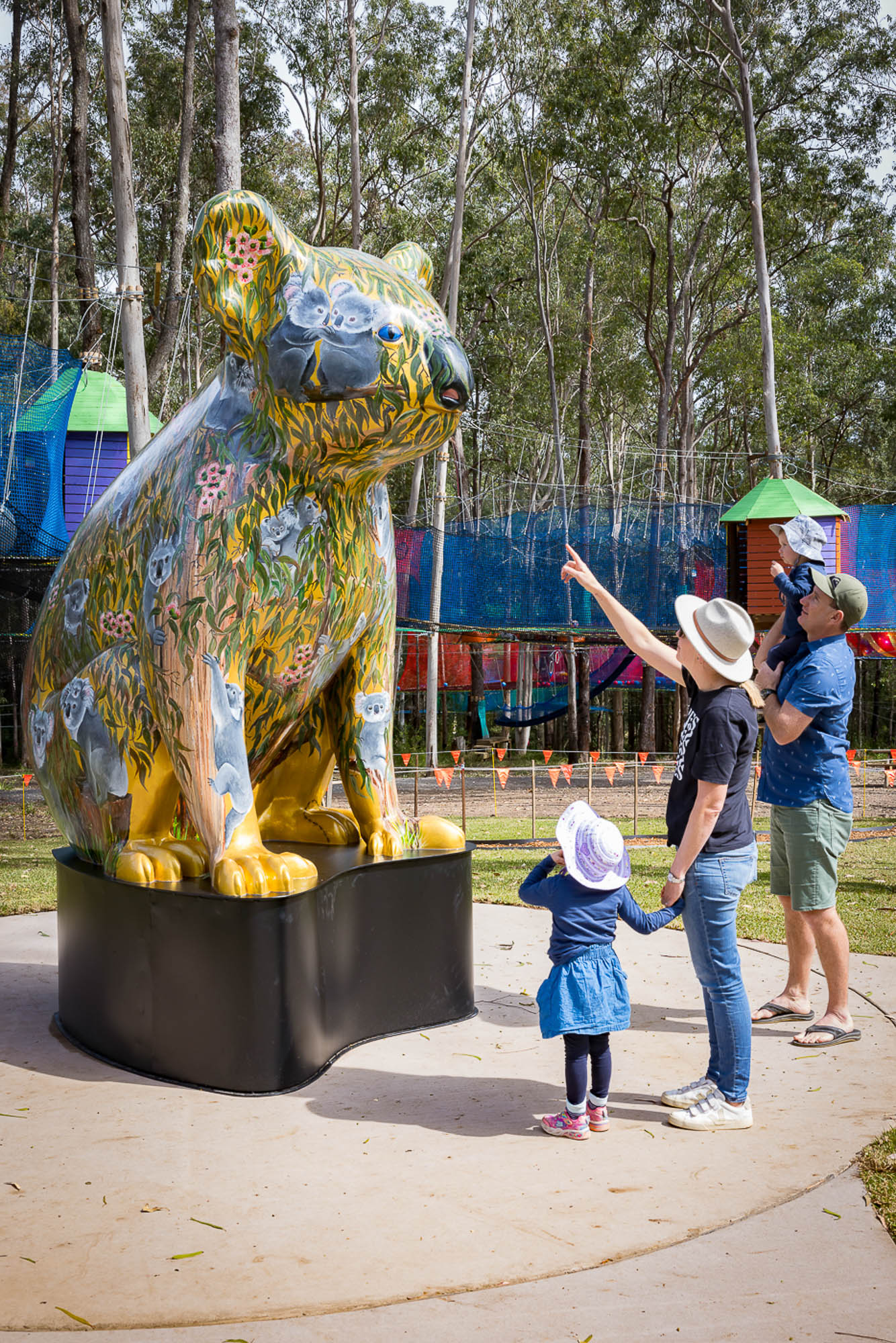 A group of people looking at a statue.
