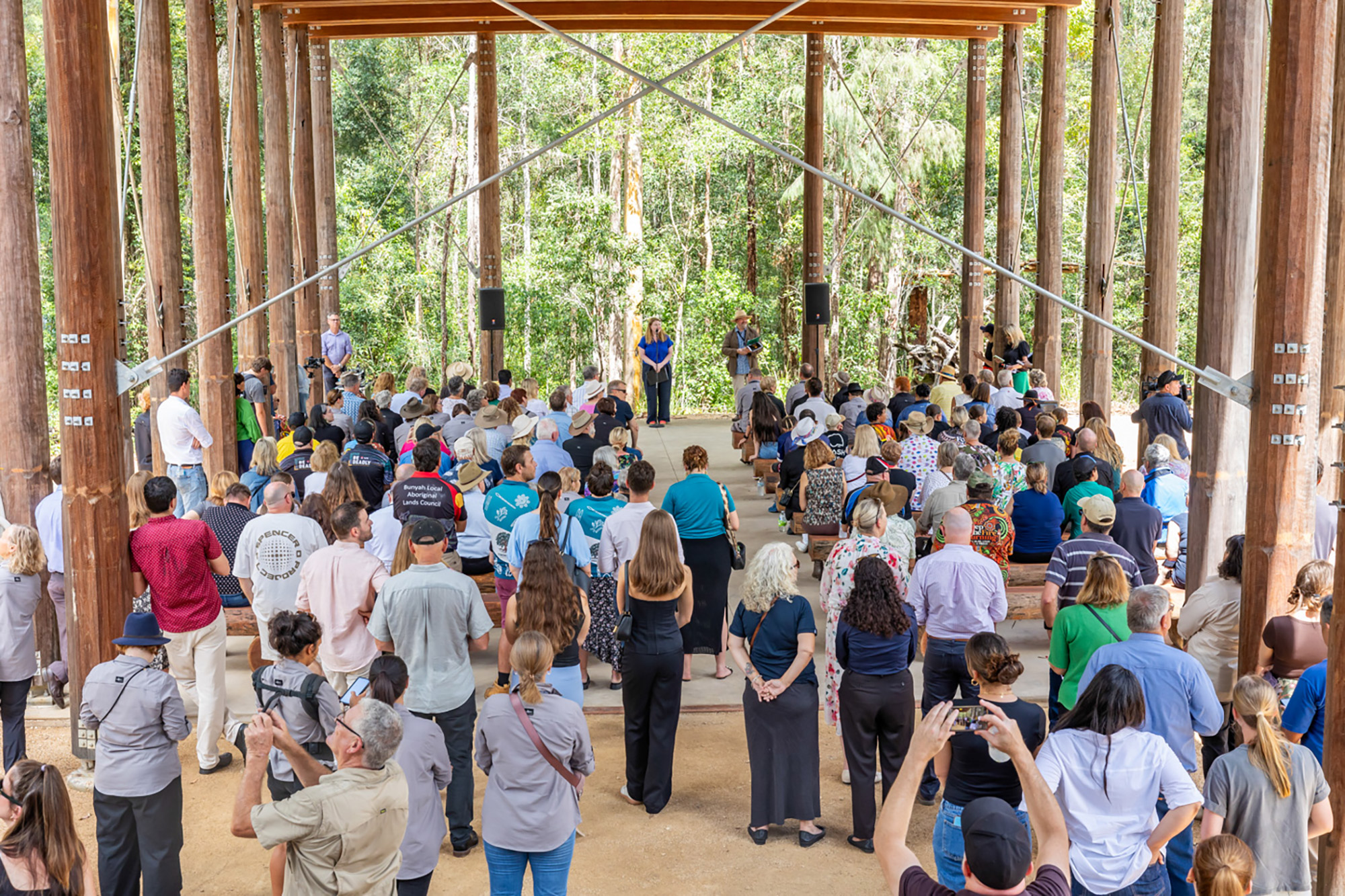 A group of people in a roped area.