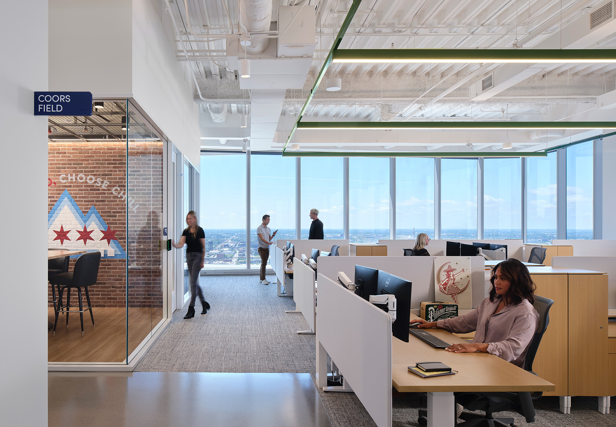 A person sitting at a desk in an office.