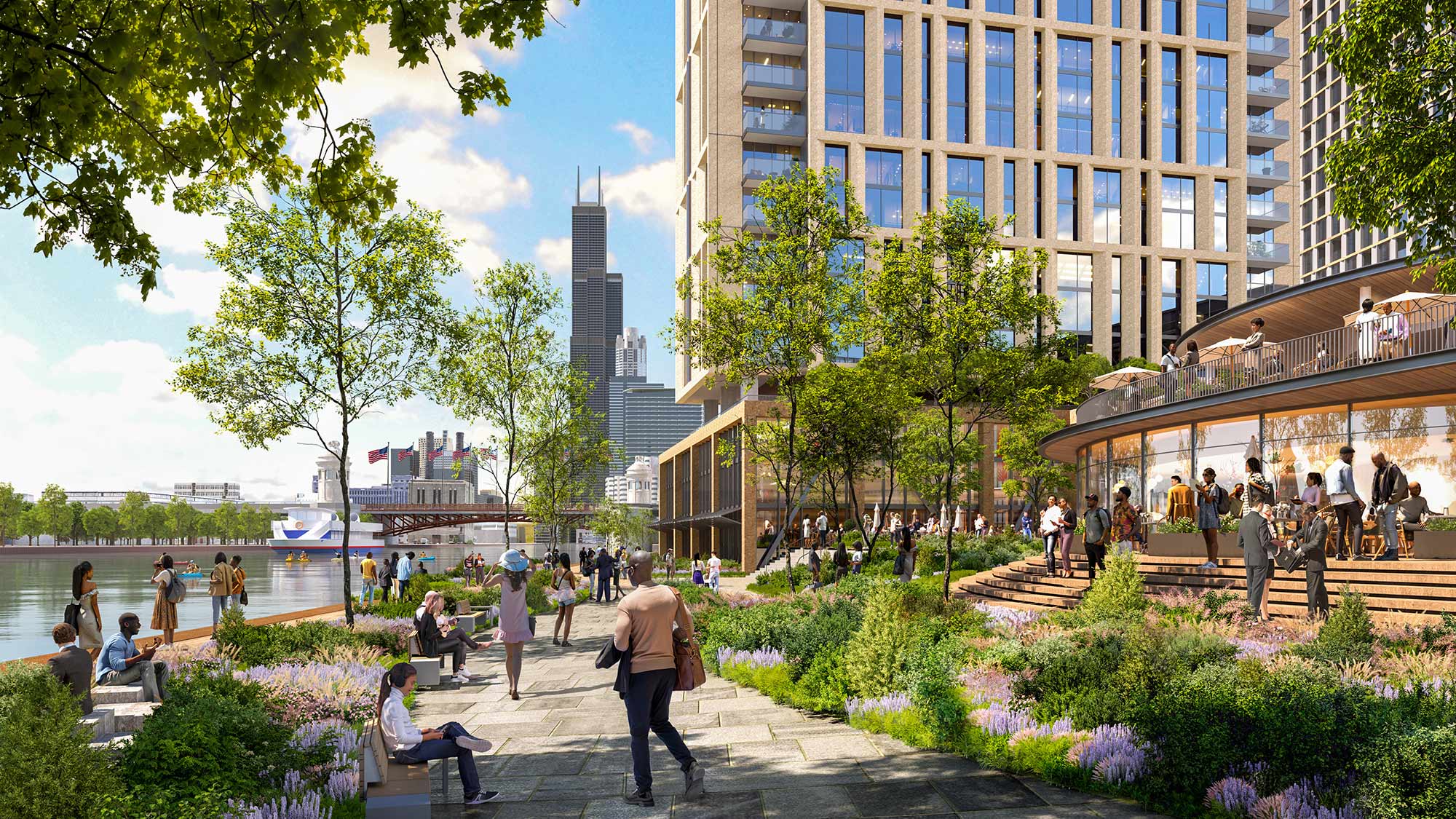 A group of people walking around a park by a body of water.