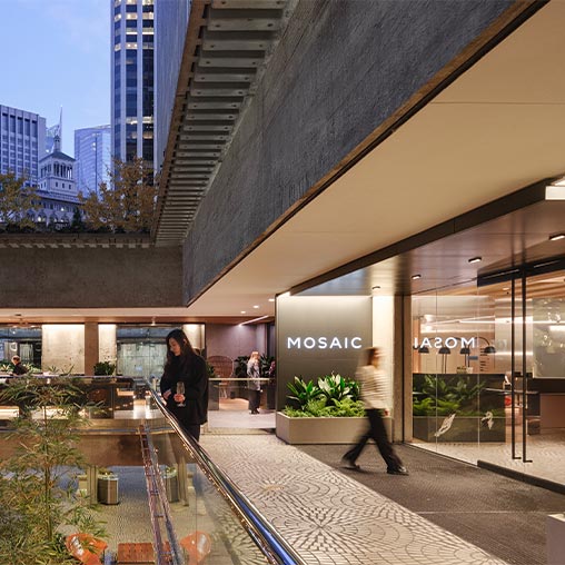 A group of people walking in a mall.