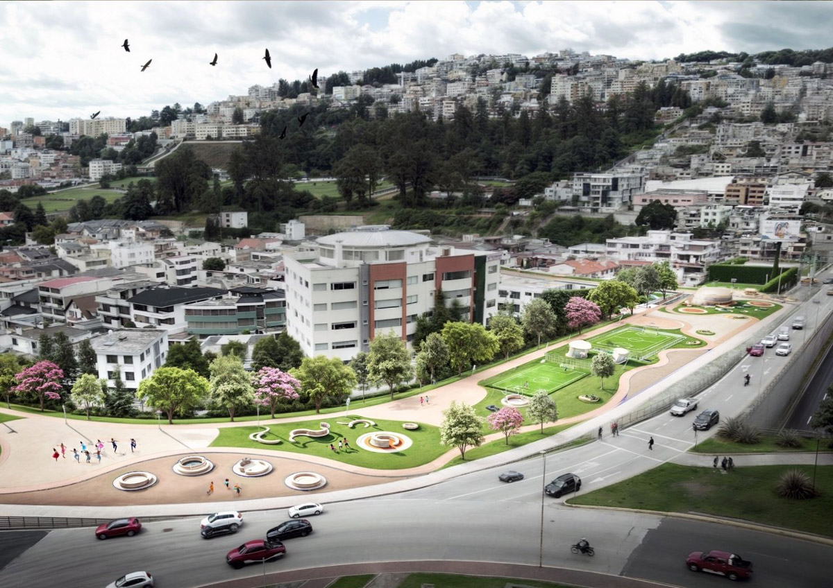 A large building with many windows and cars parked in front of it.