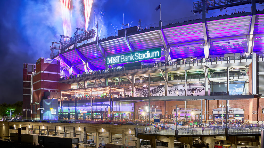 A stadium with a large stage and a large crowd of people.
