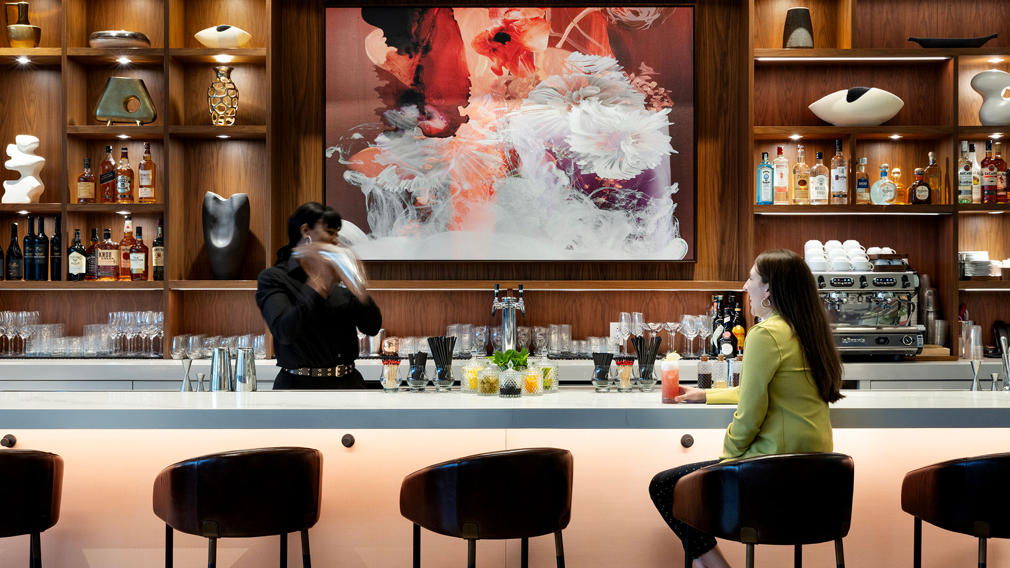 A person sitting at a bar.