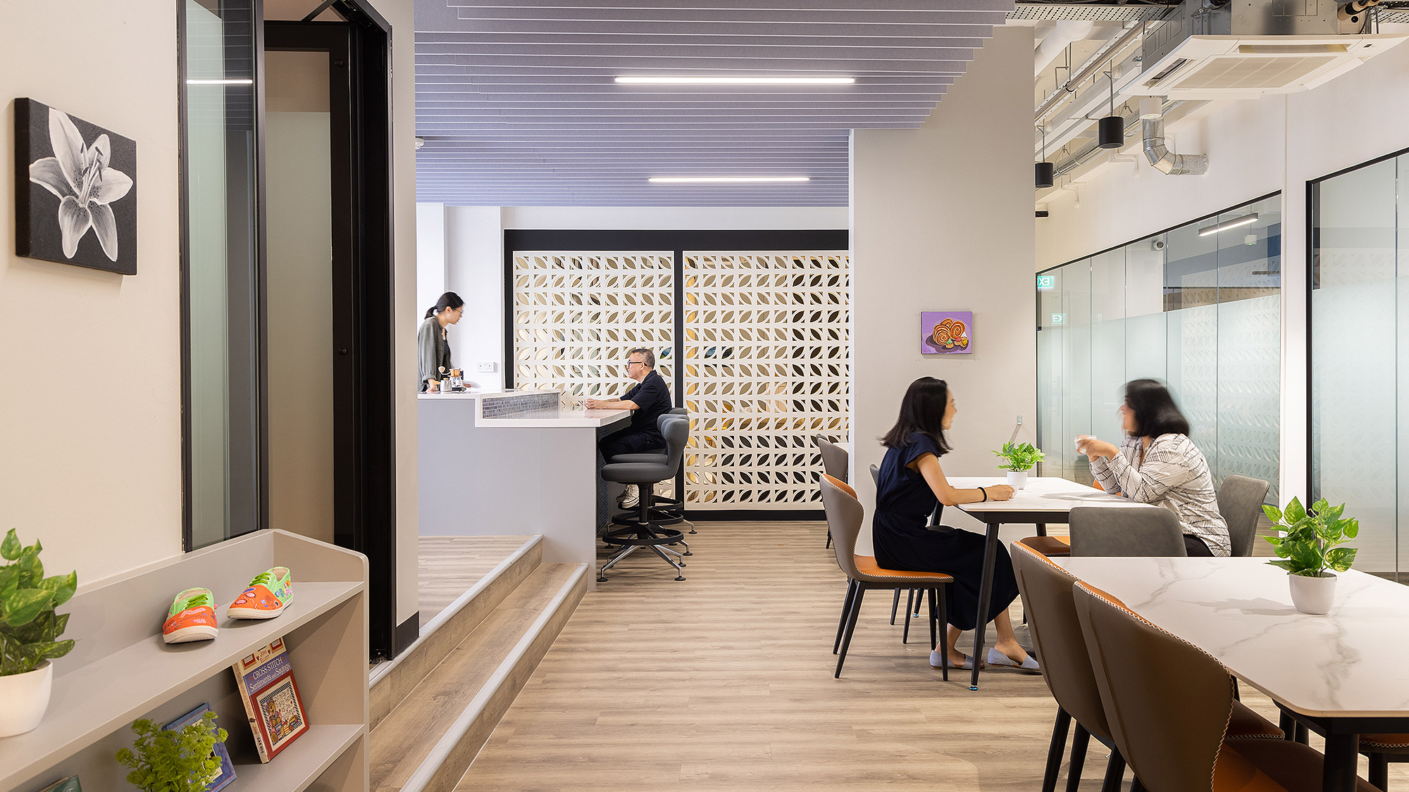 A group of people sitting at a table in a room.
