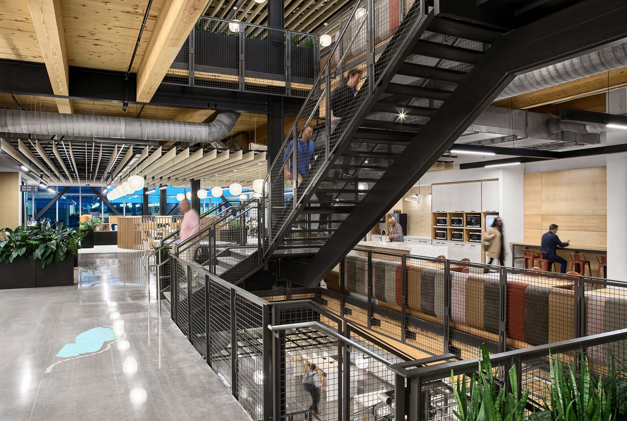 A group of people walking up a staircase.
