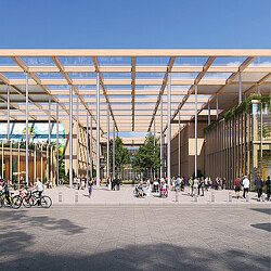 A group of people walking outside of a hospital