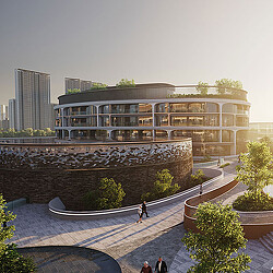 A building with a stone wall and a stone wall with people walking around.