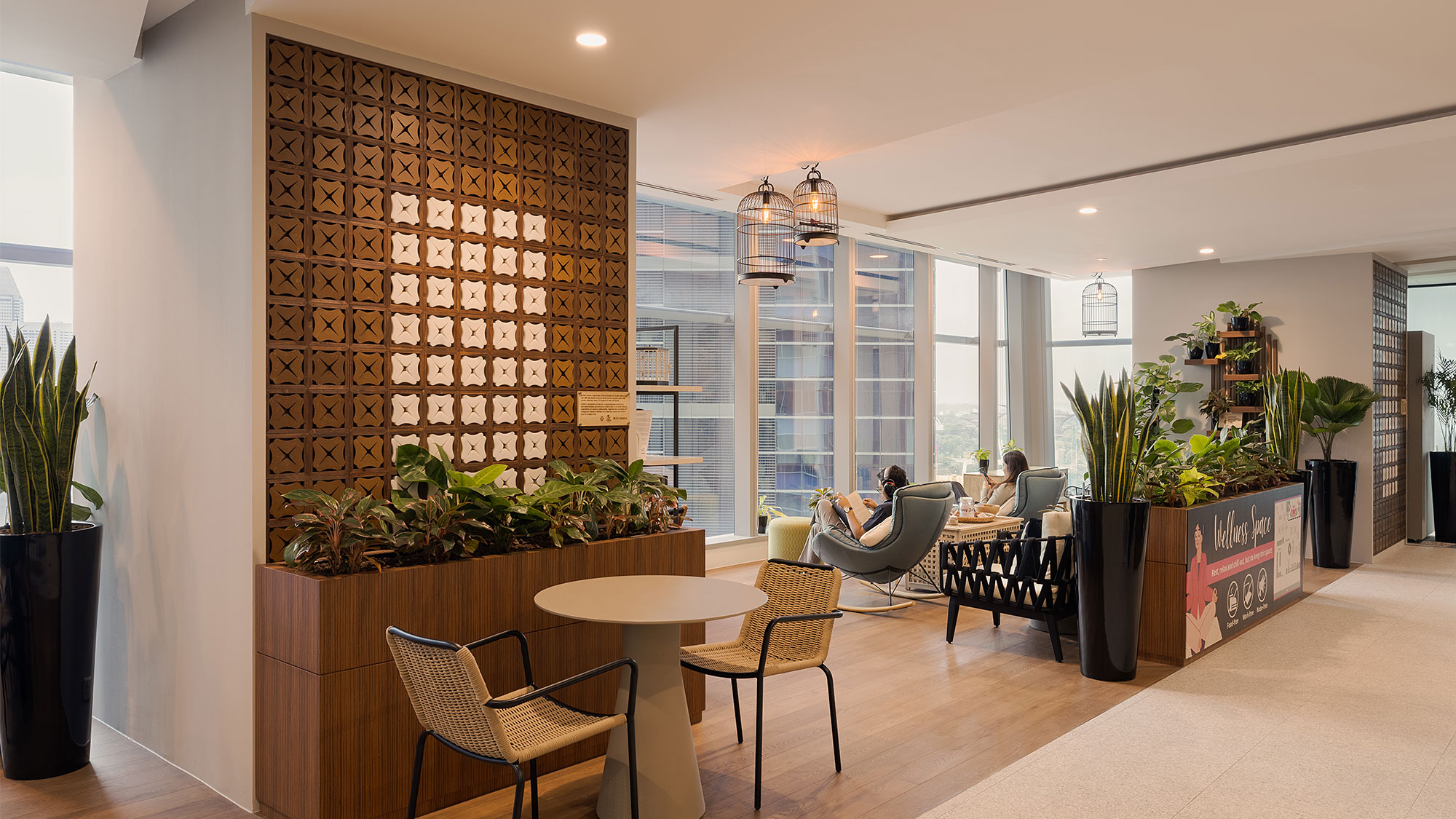 A room with a table chairs and a large window.