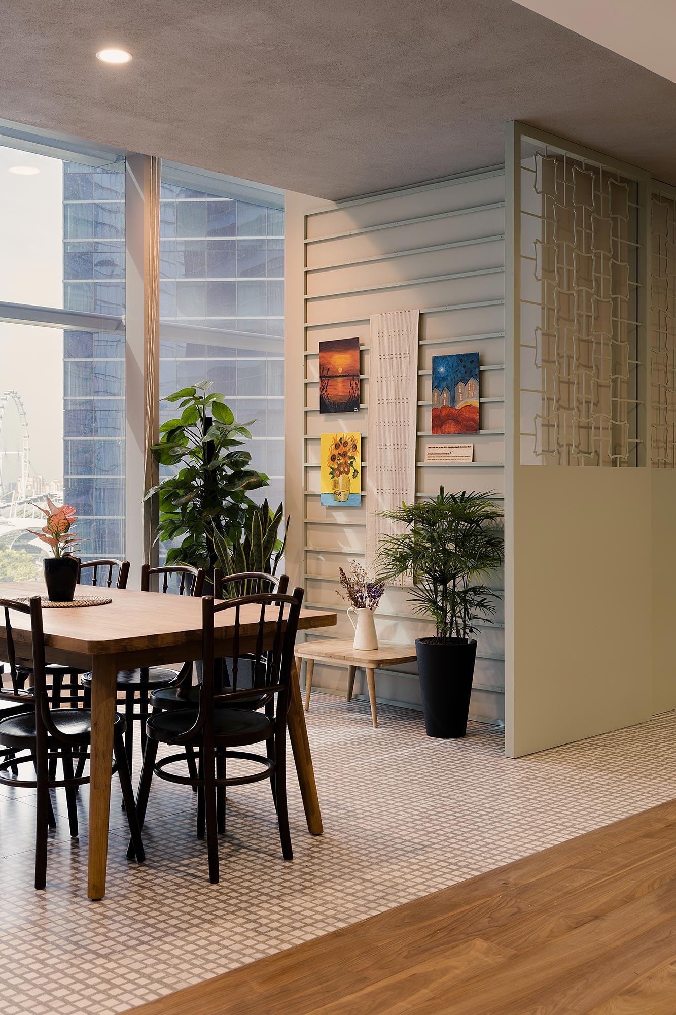 A dining room with a table and chairs.