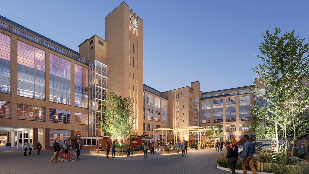 A group of people walking around a large building.