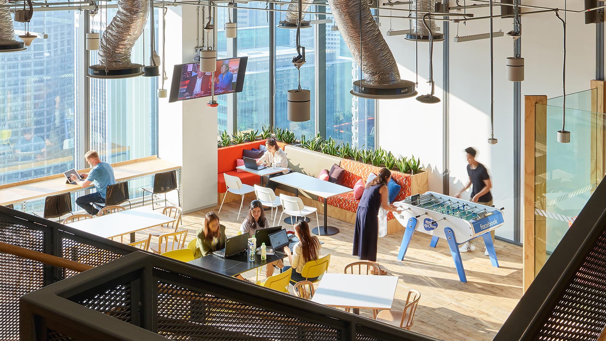 A group of people sitting at tables.