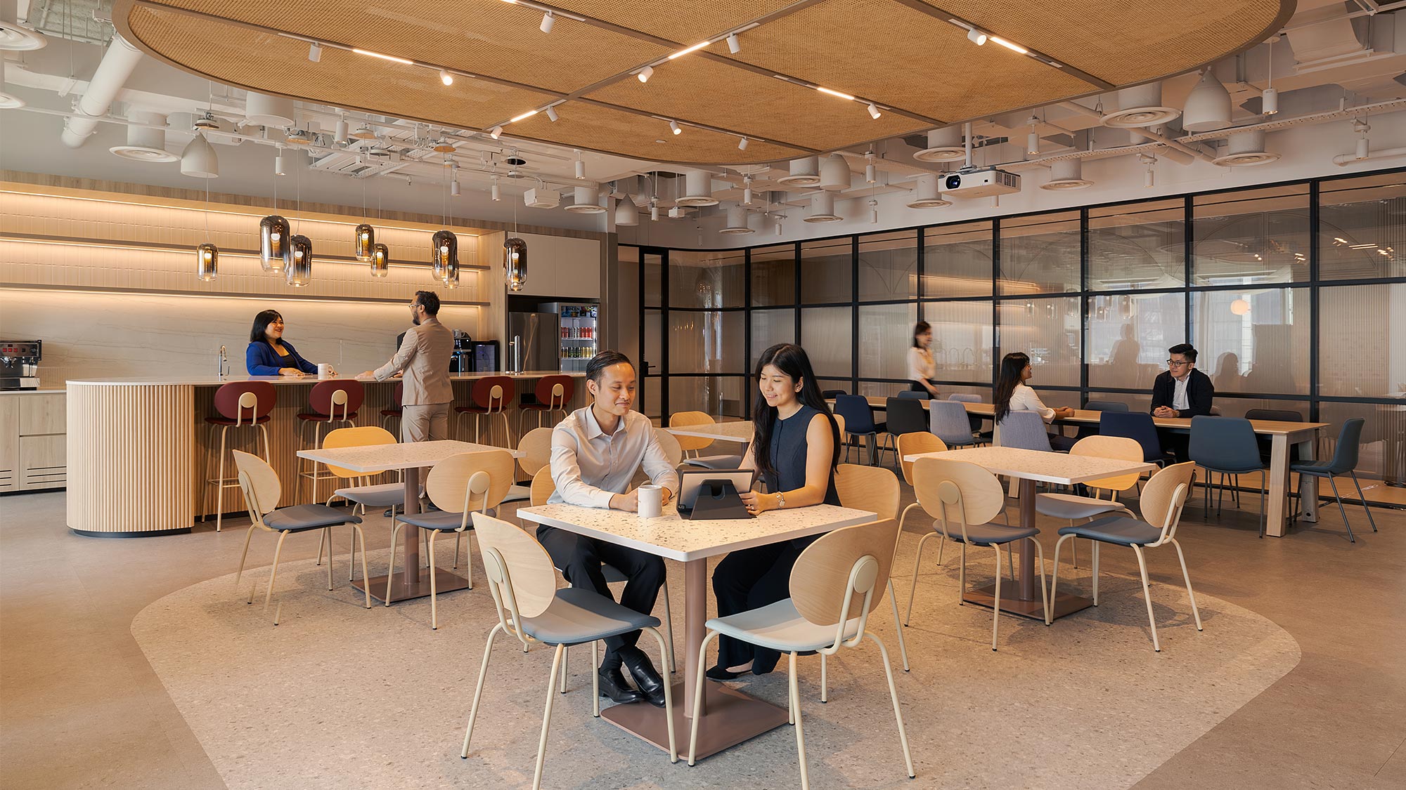 A group of people sitting at tables.