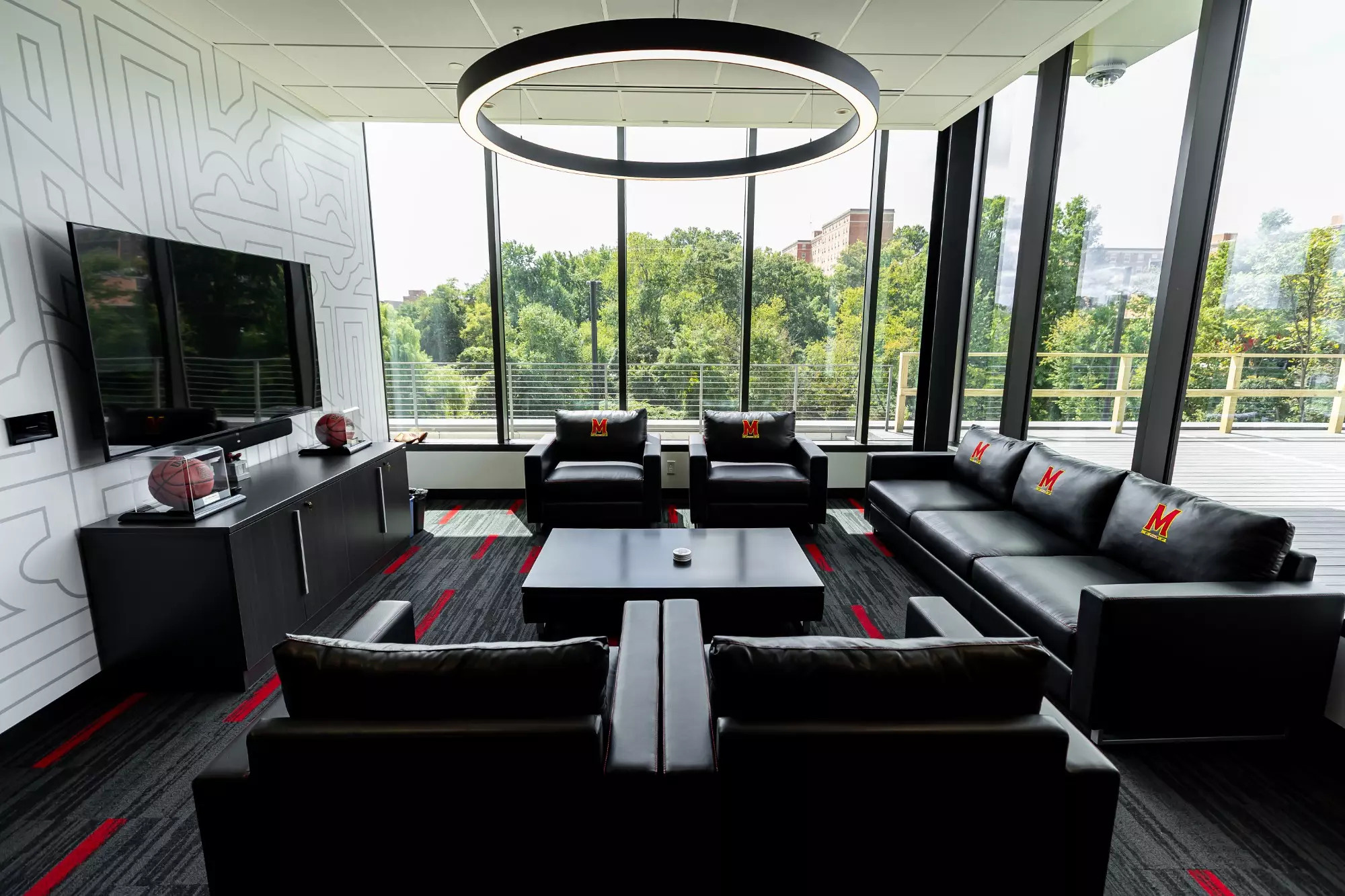 A room with a couch and a table.