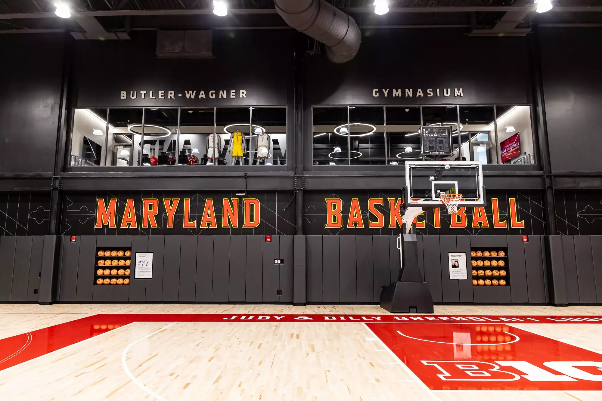 A large black machine with orange text.